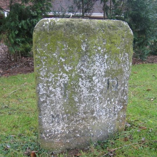 Milestone, Banbury Road; by No 180, opp. Milestone Road