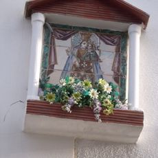 Ceramic panel of Our Lady of the Forsaken at Crist de la Fe street