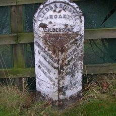 Milestone Approximately 300 Metres North Of Entrance To Woodlands