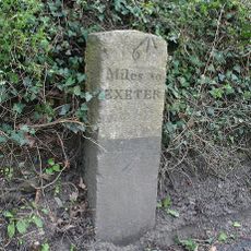 Milestone, Six Mile Hill, by "Hazelbank", 150m W of Two Crosses
