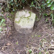 Milestone, just E of Lobhill Cross, 50m up (W) from Lobhill Lodge