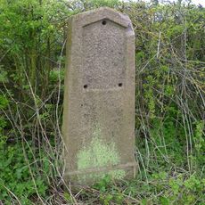 Milestone, W of The Grange and Globe Farm