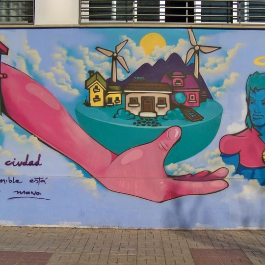 Mural que visibiliza uno de los objetivos de desarrollo sostenible: Ciudades Sostenibles. Constituyó la participación del artista en el II Concursode Arte Urbano: En movimiento por tu barrio 2022, donde obtuvo el tercer premio.