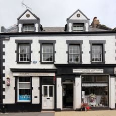 Old Bank House and attached gateway at left